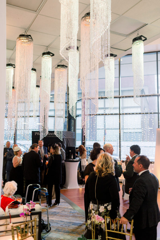 Toronto wedding reception crystal chandeliers with guests mingling