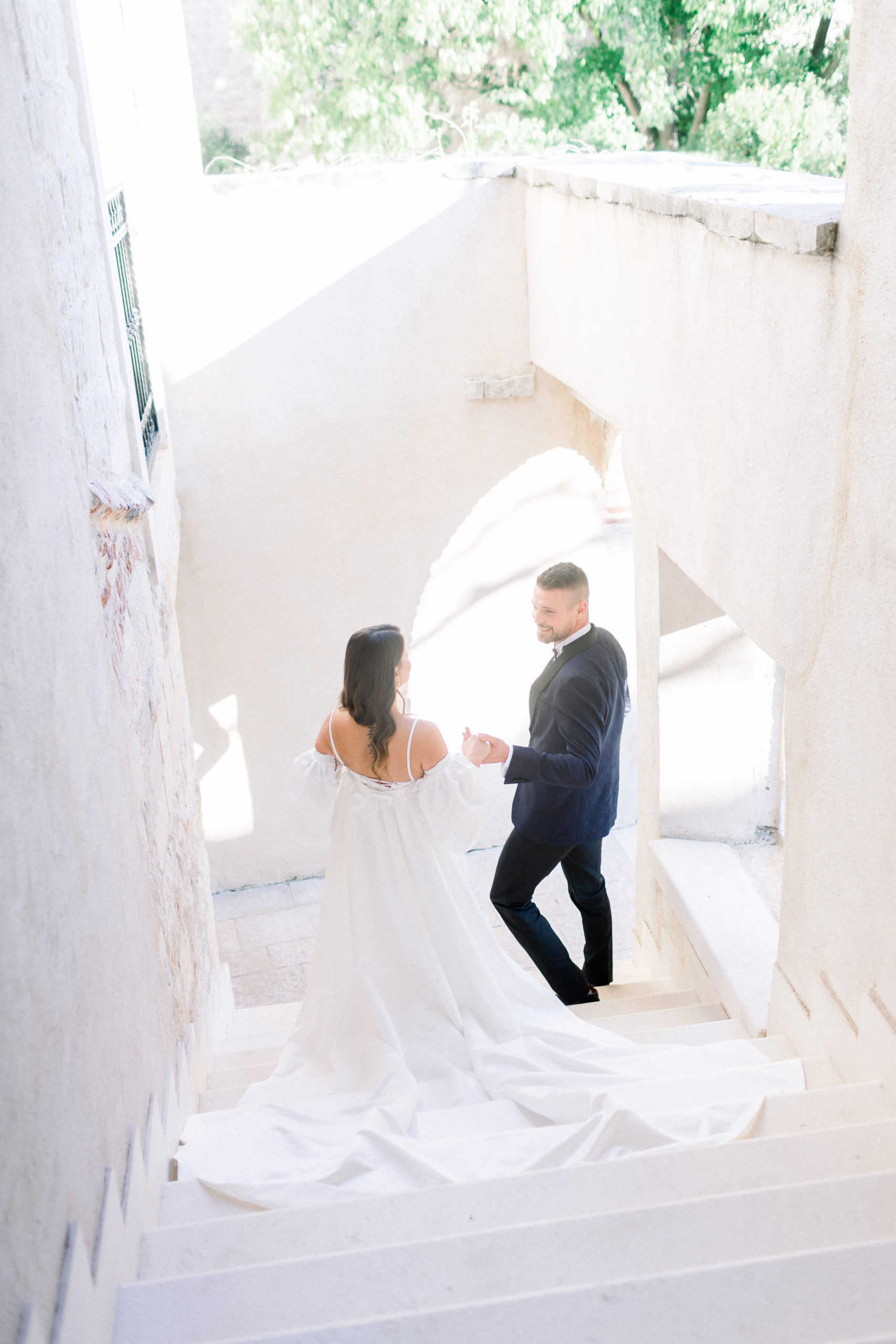 couple walking down steps at Croatia elopement