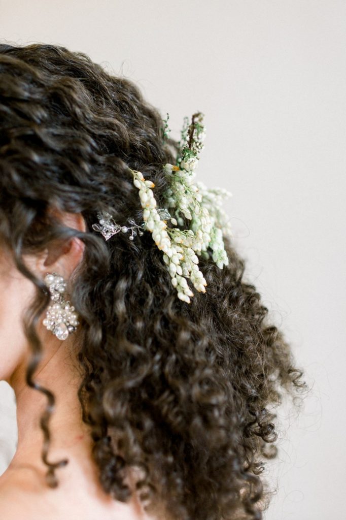white pieris japonica flowers in brides hair