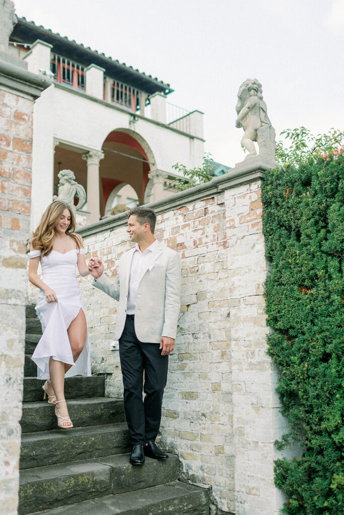 couple walking down stairs at italian villa