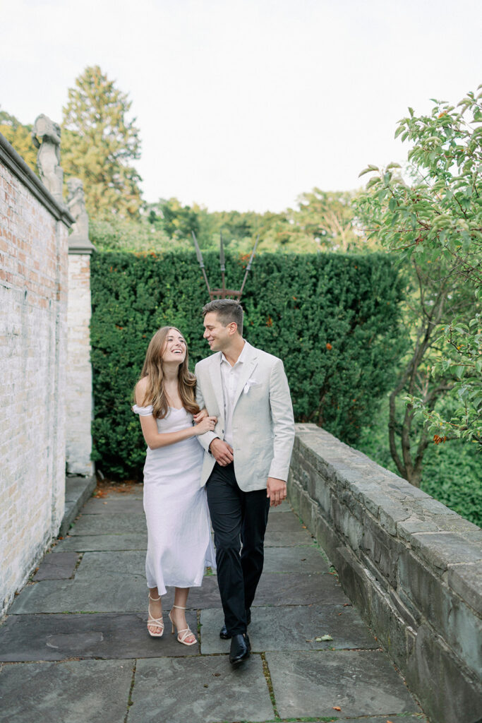 couple walking on terrace at italian villa